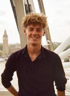 dylan cleverly poses with big ben in london behind him